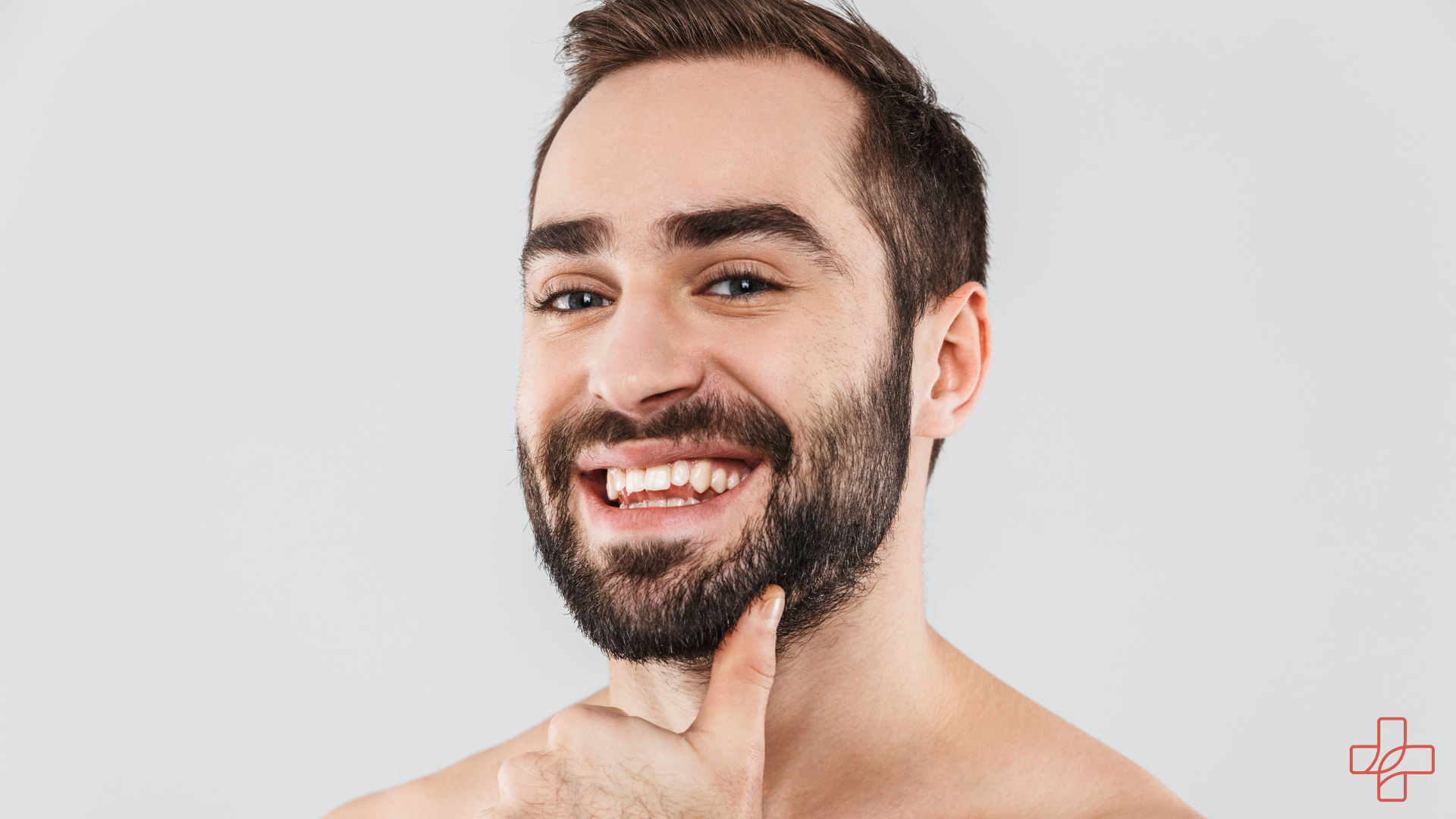Mann mit Bart lacht in die Kamera Hypogen Care